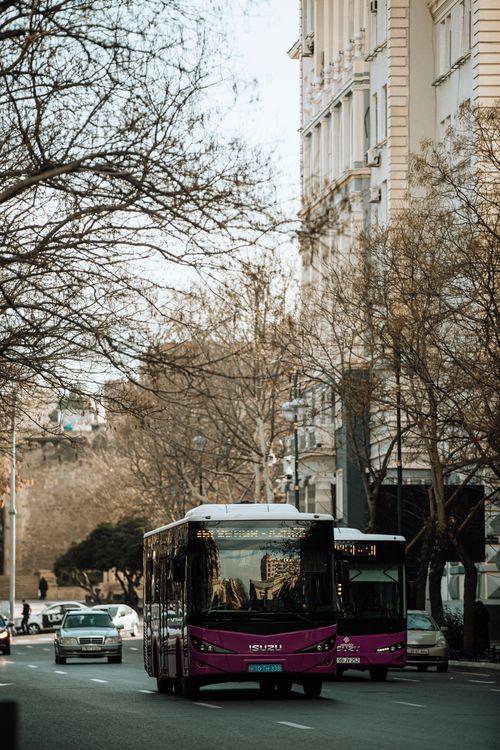 Free Urban view of public transport buses on a busy street in Baku, Azerbaijan. Stock Photo