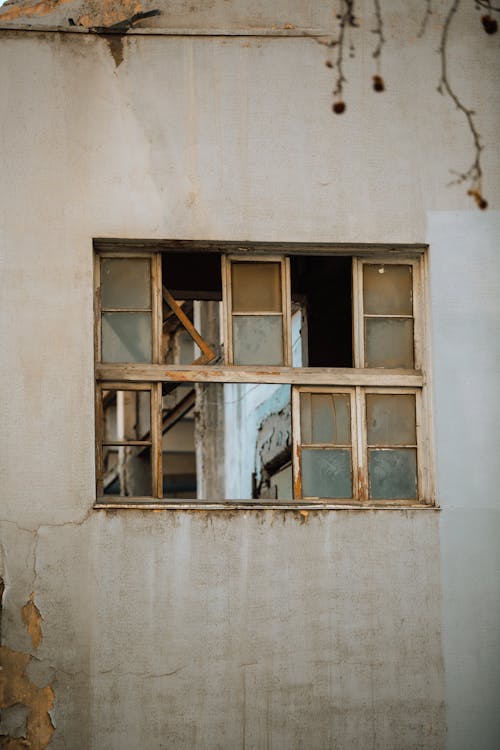 Old Broken Window of a Run Down Building