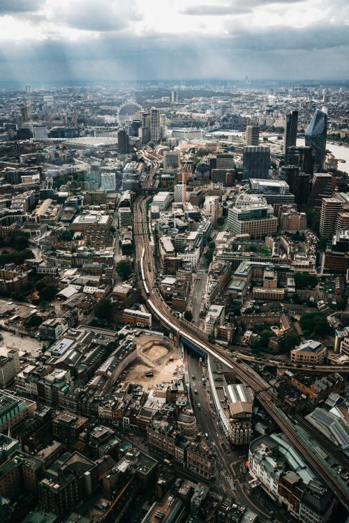 Free Aerial view of bustling London, showcasing iconic skyscrapers and urban skyline. Stock Photo