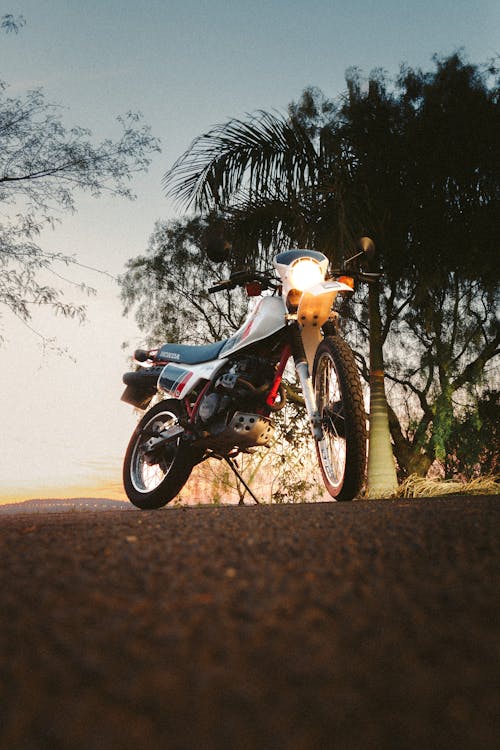 A Honda Motorcycle on the Street in the Evening 