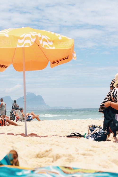 Beach Umbrella and People on Beach