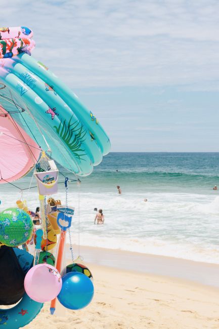 Vibrant beach inflatable toys hanging by the sea at a Rio de Janeiro beach.