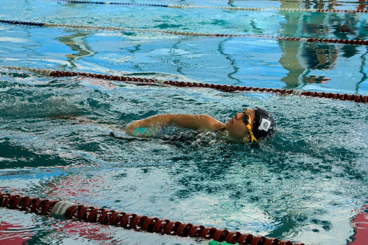 Man Swimming In Pool