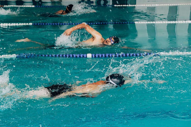 Men In Training At Swimming Pool