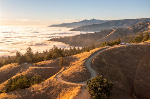 Clouds below Hills at Sunset