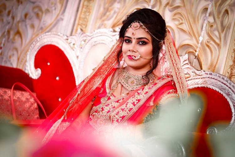 A Hindu Bride In Traditional Clothing And Jewelry