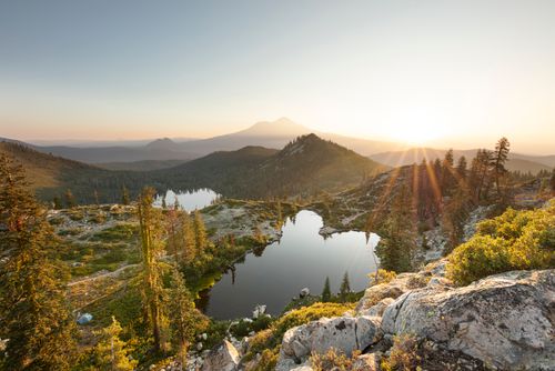 Free Beautiful mountain landscape with a serene lake and sunset view. Stock Photo