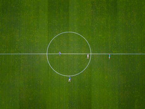 Aerial shot of people on a soccer field in Luzern, Switzerland.