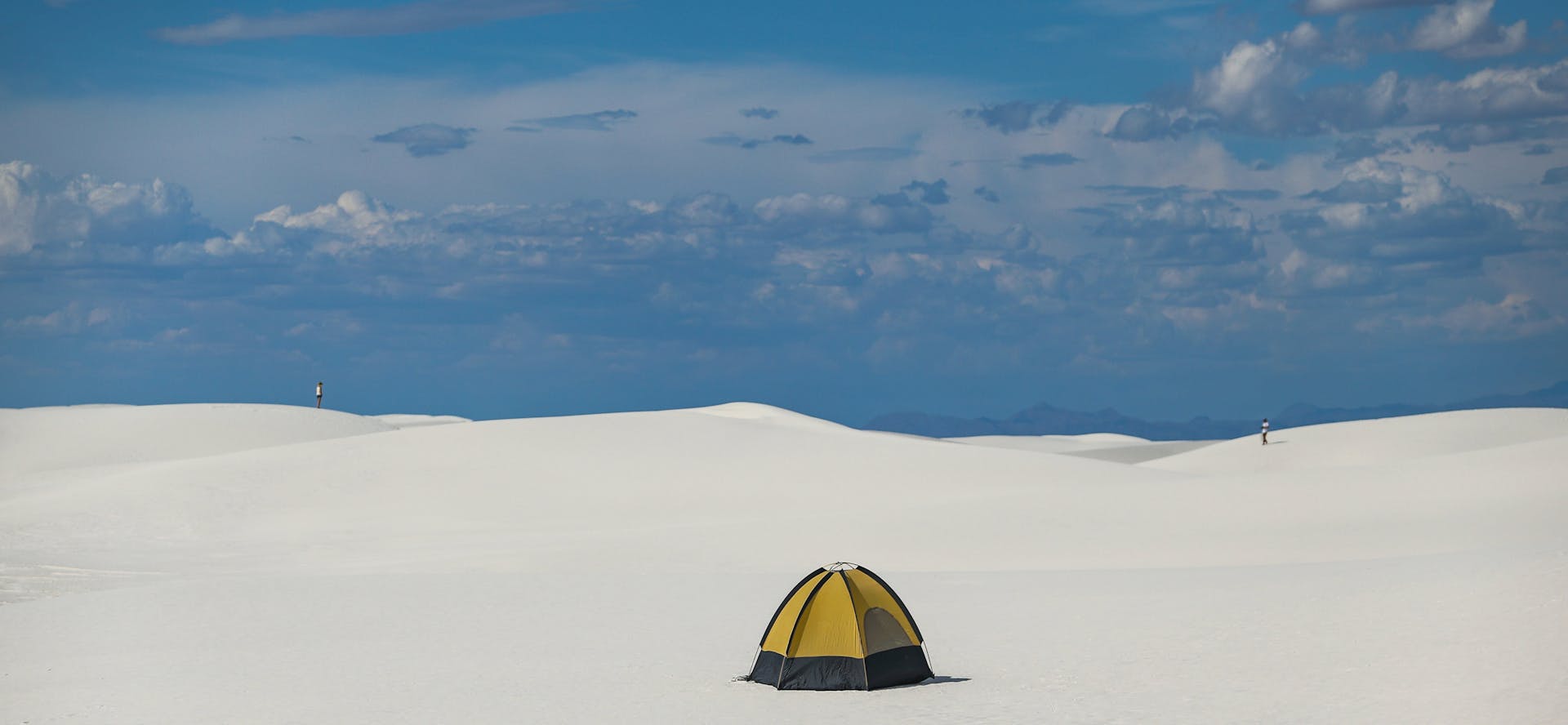 Tent on Snow High in Mountains