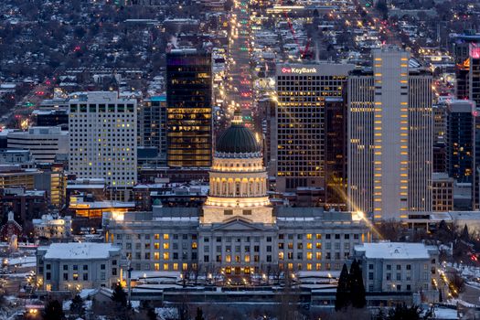 A breathtaking view of Salt Lake City's skyline illuminated at night, featuring the Utah State Capitol.