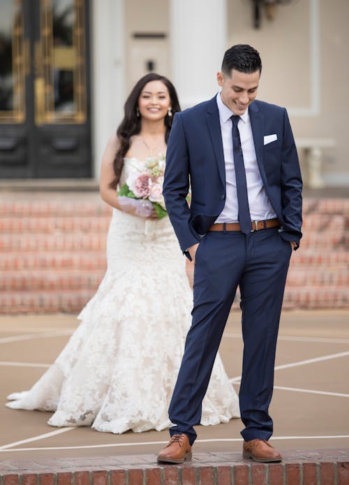 Smiling Newlyweds Standing and Posing