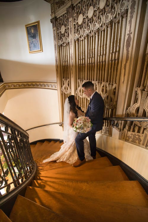 Newlyweds Standing on Stairs
