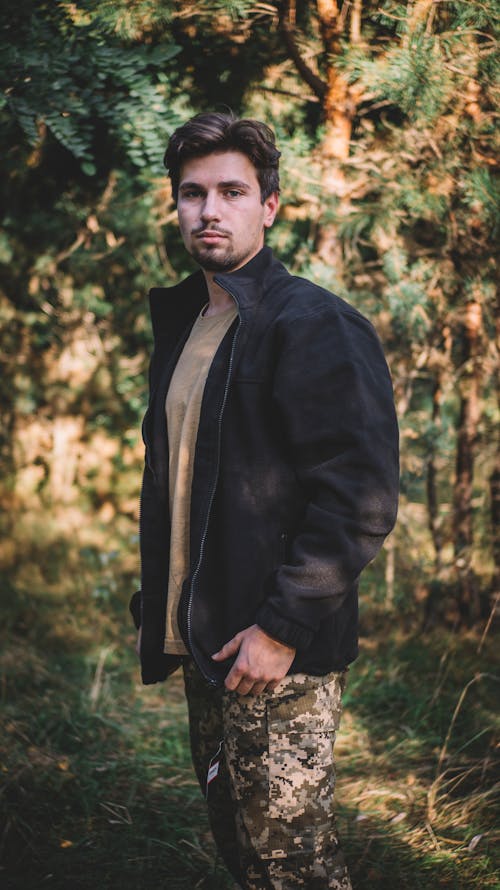 Man in Jacket Standing in Forest