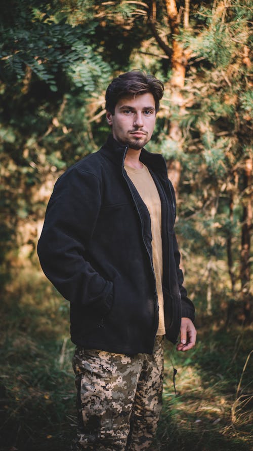 Portrait of Man in Jacket in Forest
