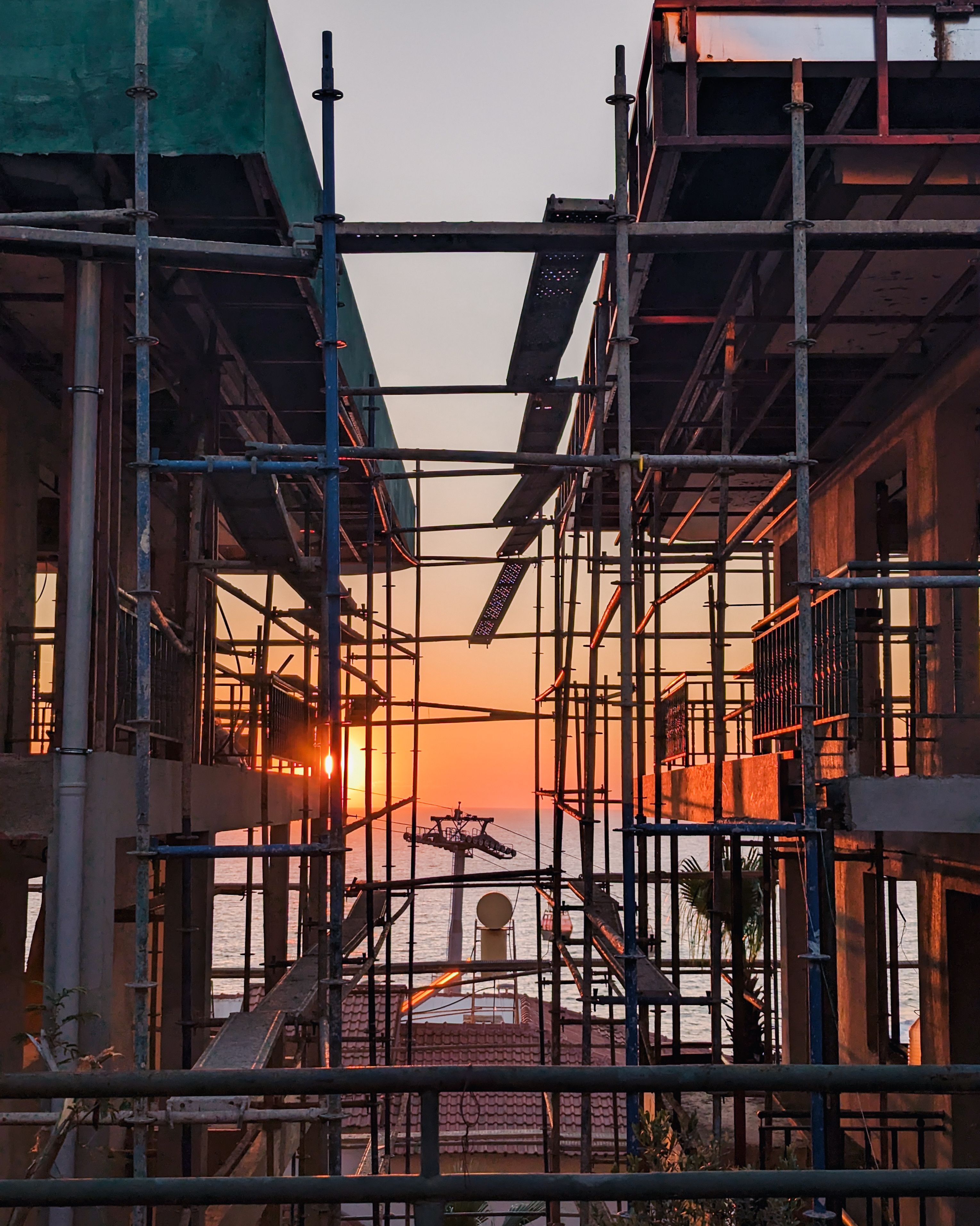 Scaffolding on Sea Shore at Sunset · Free Stock Photo