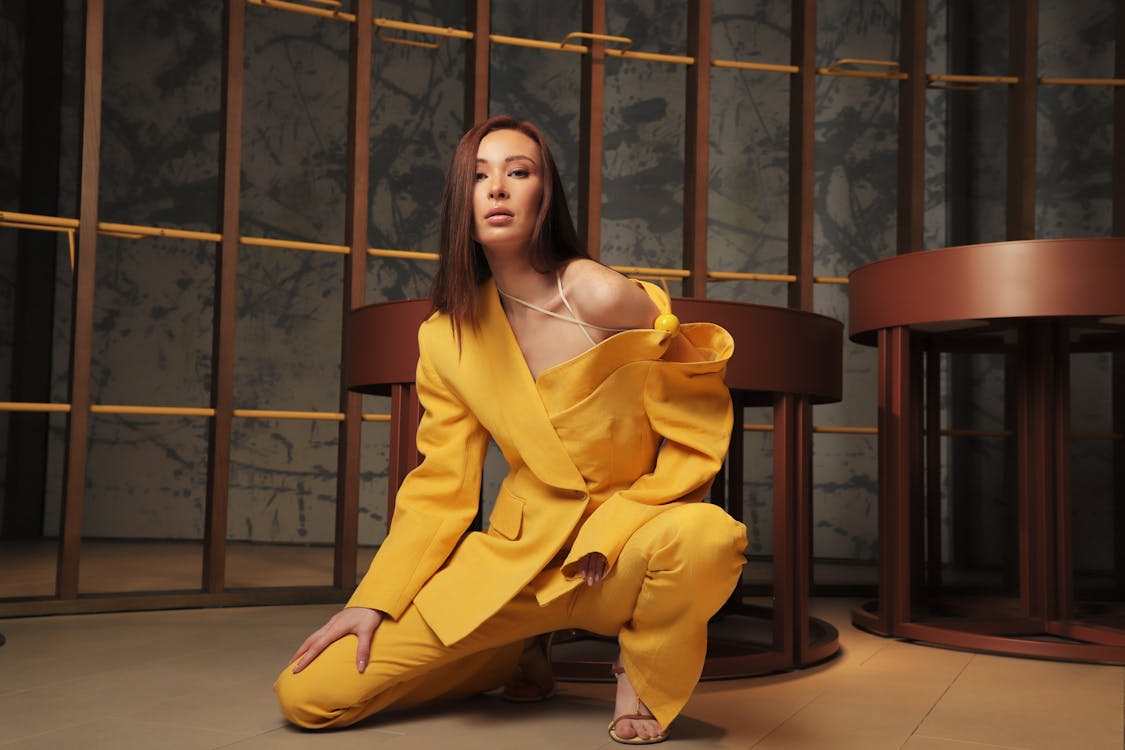 Young Brunette Woman Posing in Yellow Blazer and Pants