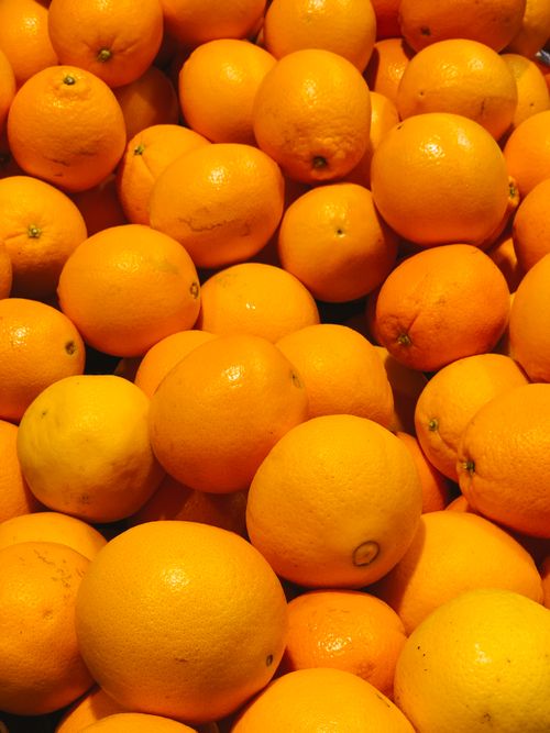 Free Vibrant display of fresh oranges at a market in Napoli, Italy, showcasing citrus freshness. Stock Photo