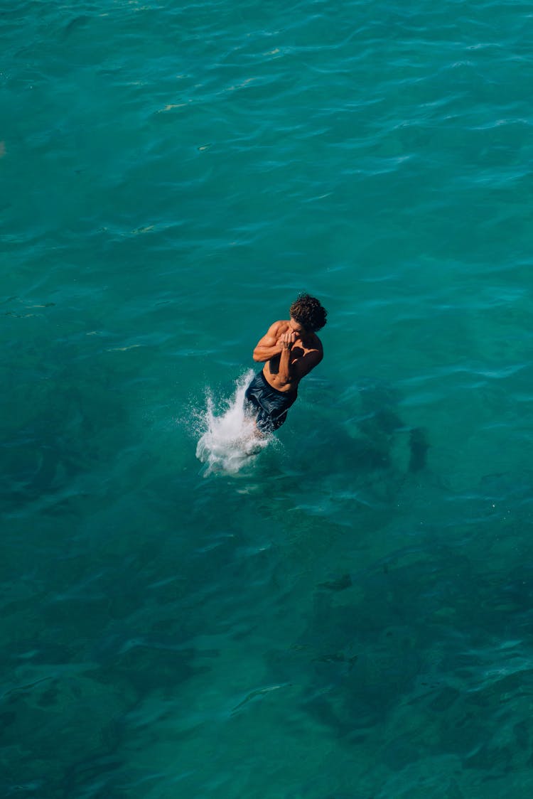 Man Jumping Into Water