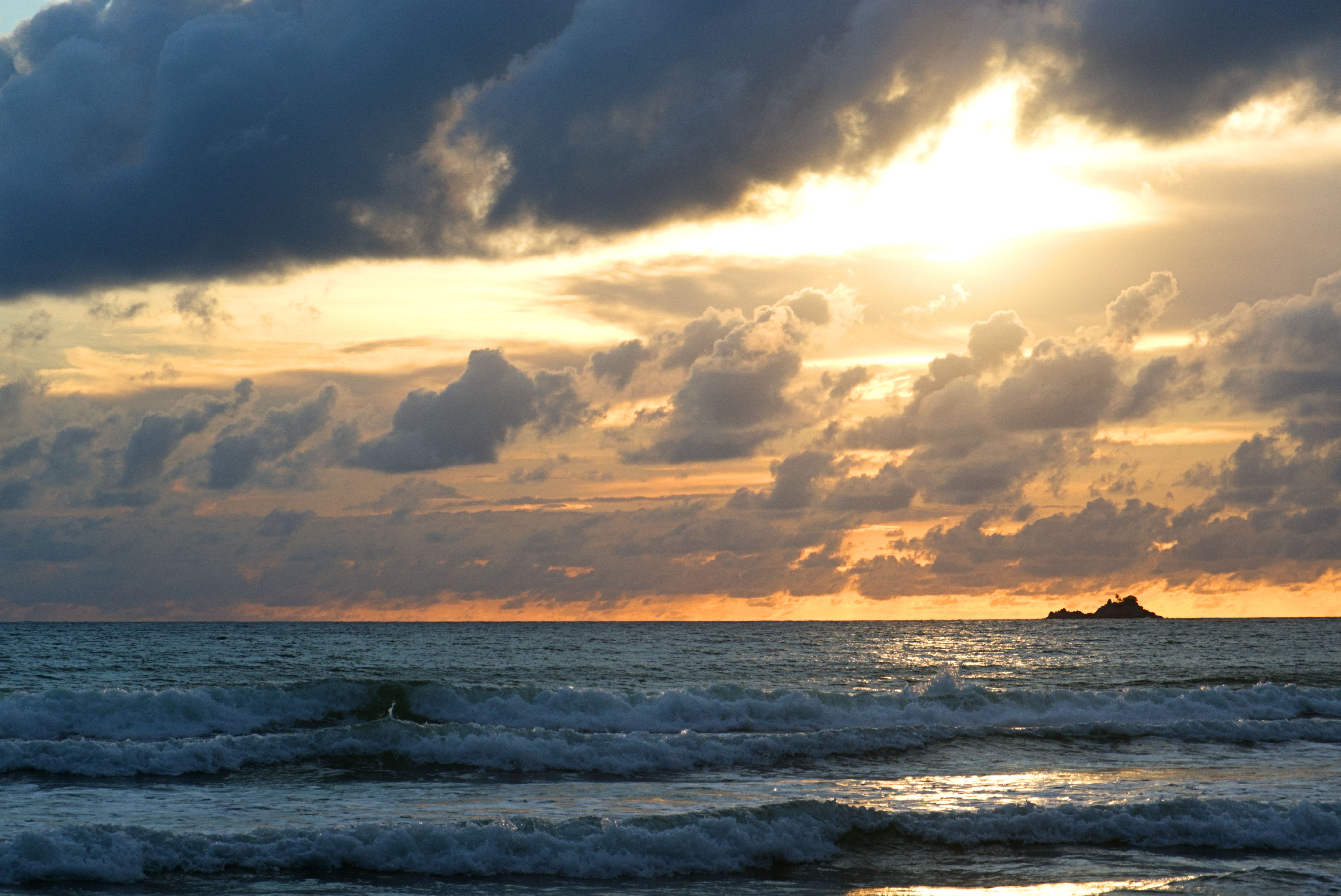 Clouds and Sunlight over Sea Shore at Sunset · Free Stock Photo