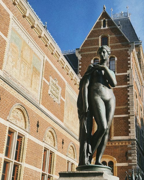 Bronze Statue in front of the Rijksmuseum in Amsterdam, the Netherlands 