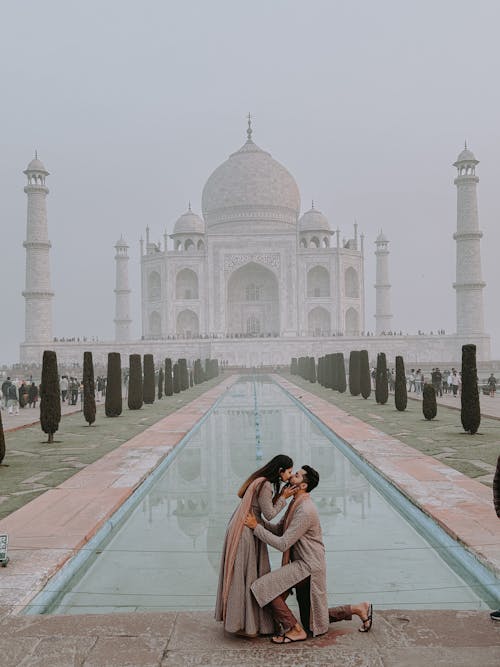 Couple Kissing with Taj Mahal behind