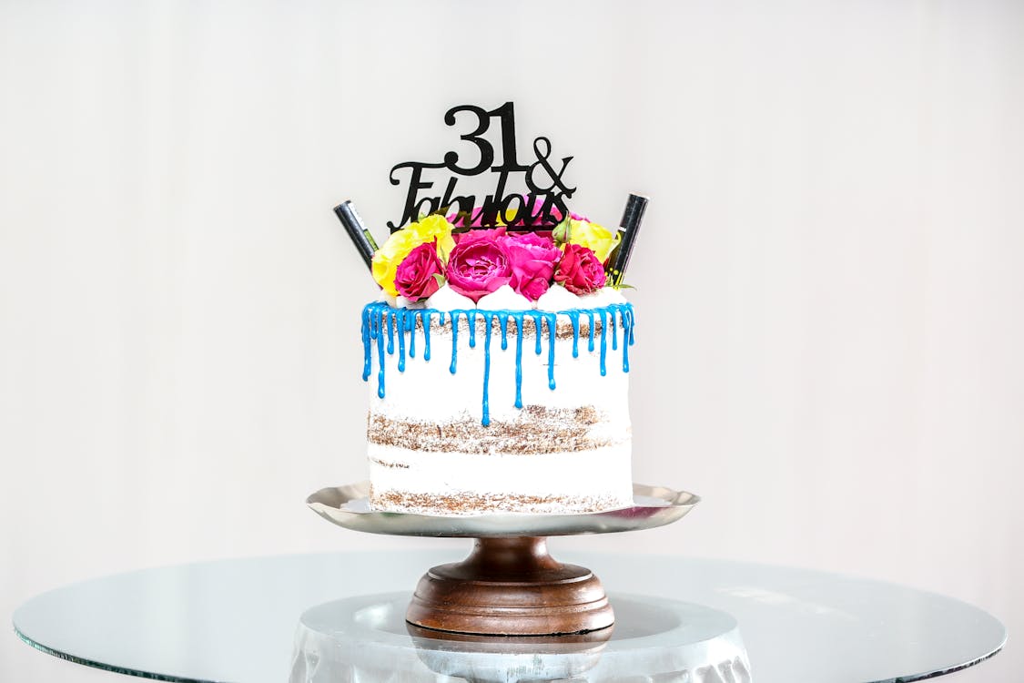 Free Baked Cake on Gray Cake Stand on Glass Table Stock Photo