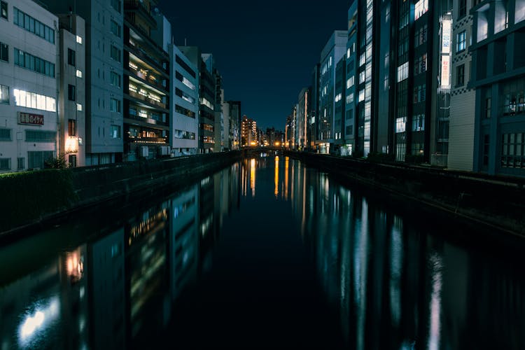 Buildings Around Canal In Tokyo At Night