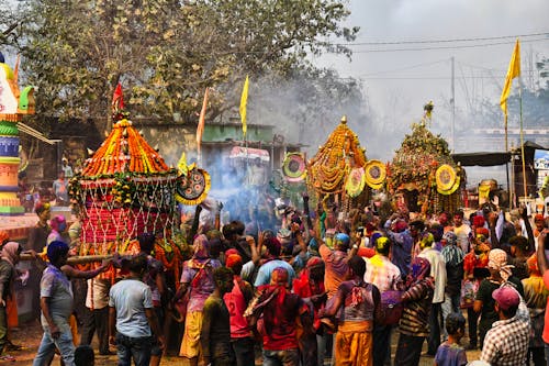 People Covered in Colorful Powder during the Holi Festival 