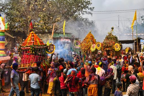 Free Colorful Holi festival celebration with crowd and decorations in Odisha, India. Stock Photo