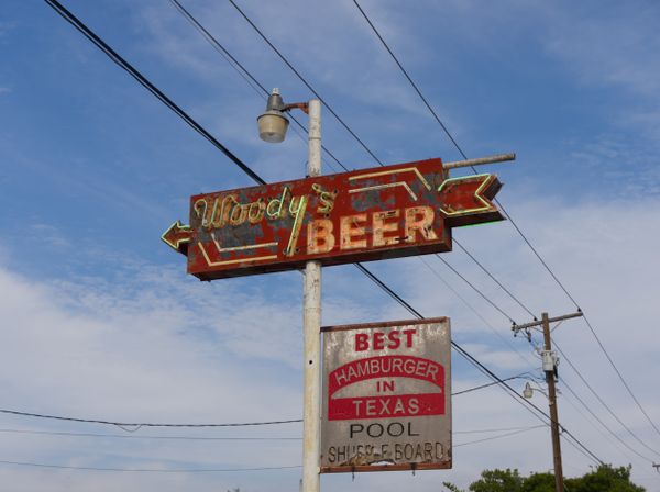 Vintage Woody Bar and Grill sign in Texas