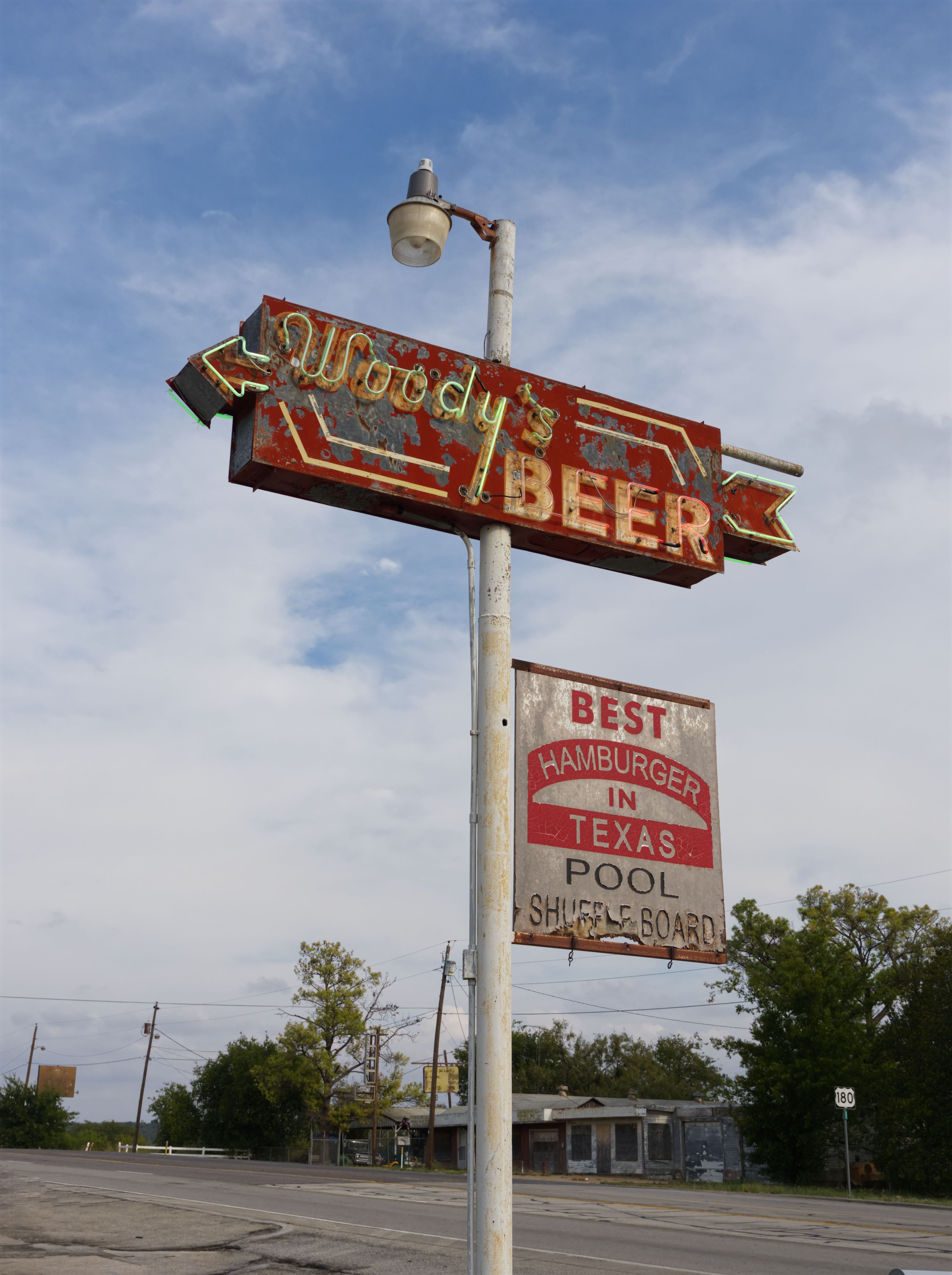 A Vintage Rusty Signpost of the Woodys Bar and Grill in Texas, USA ...