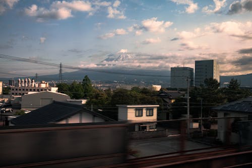 View of Buildings in City and Mount Fuji in the Background