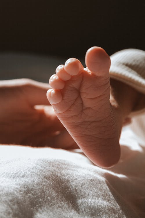 Close-Up Photo of a Newborn Baby Foot