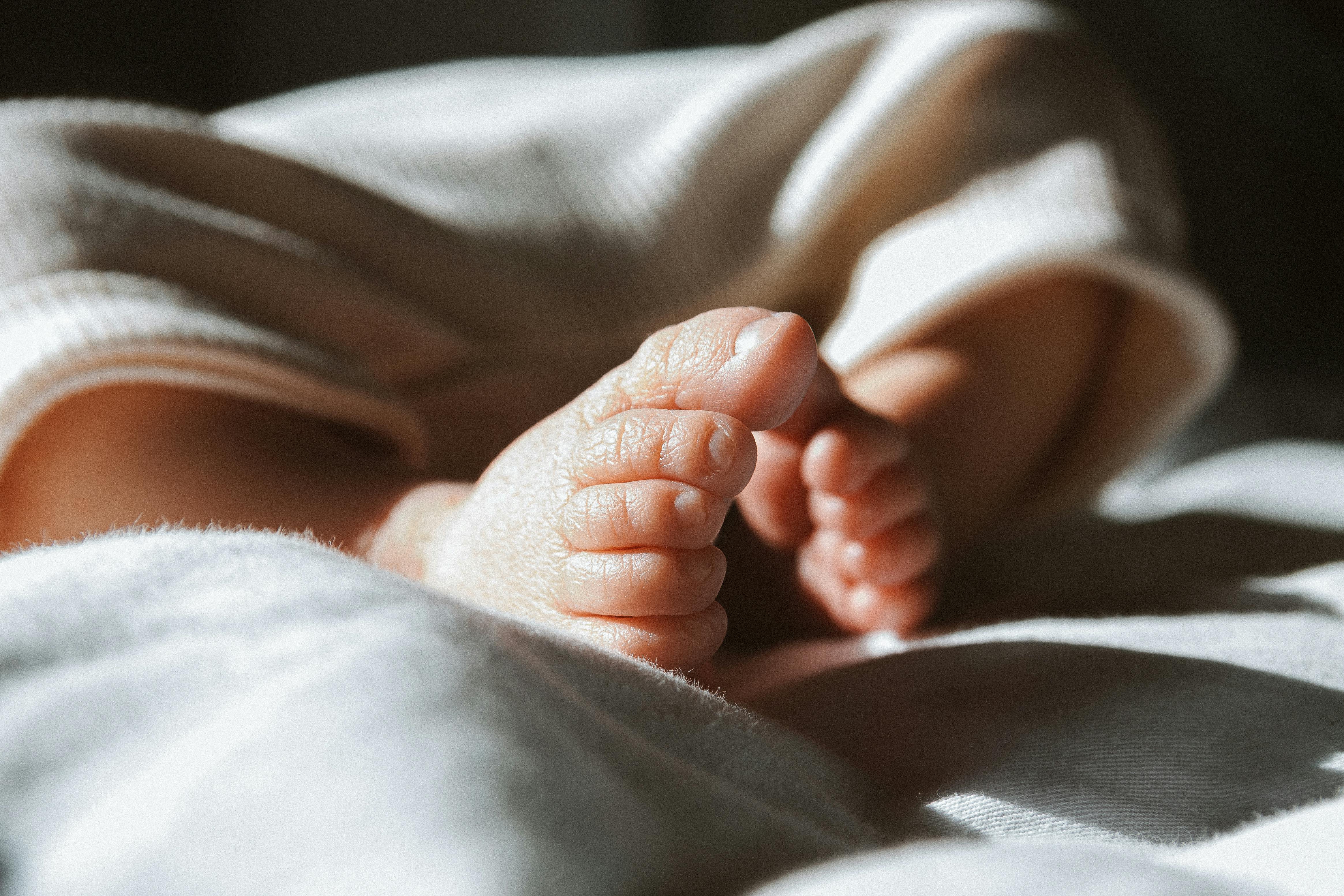 Feet of Baby Lying Down · Free Stock Photo