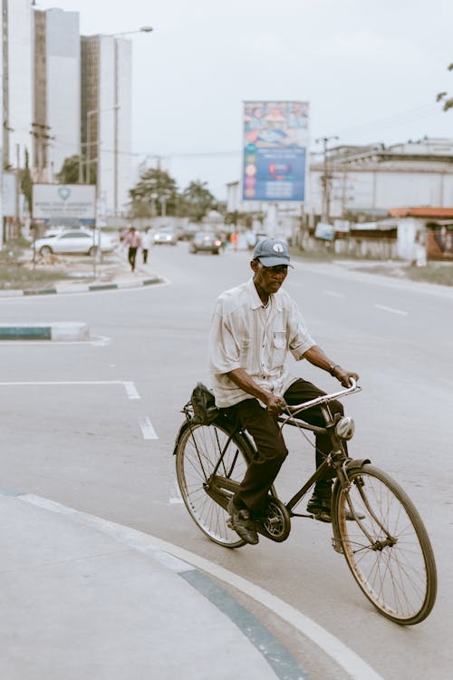 Man Riding Bike in City