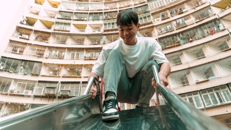 Smiling Man On Slide