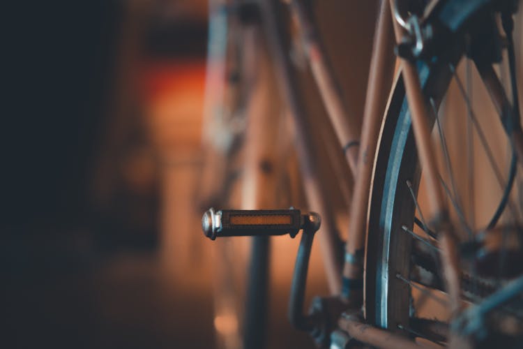 Selective Focus Photography Of Bicycle Pedal