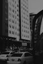 Black and White Photo of a Street and Apartment Blocks in a City