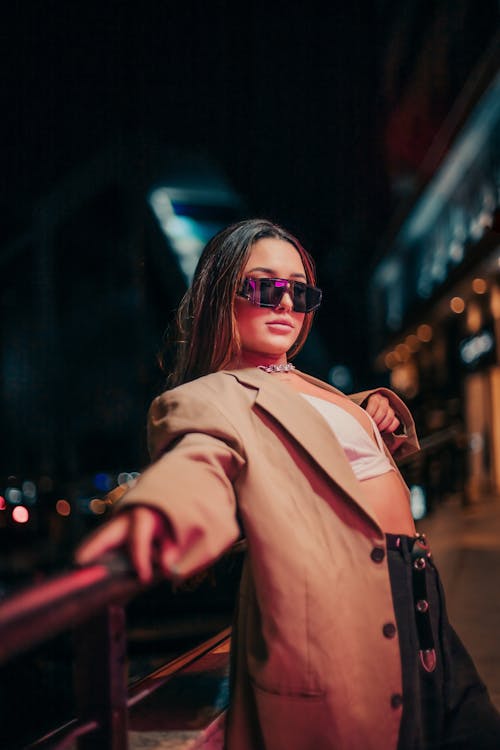 Fashionable Woman Posing in City at Night 
