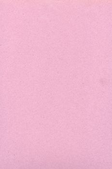 A close-up view of a pink textured background, ideal for design layouts with ample copy space.