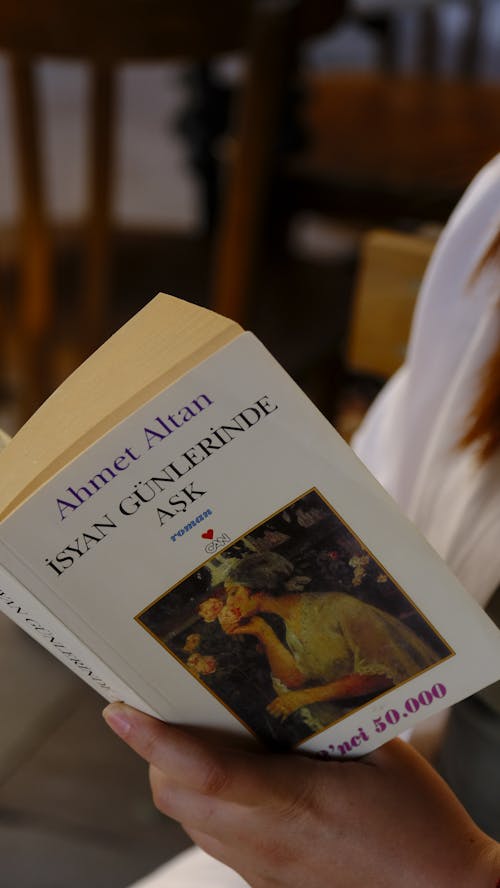 Woman Reading a Book in Turkish Language