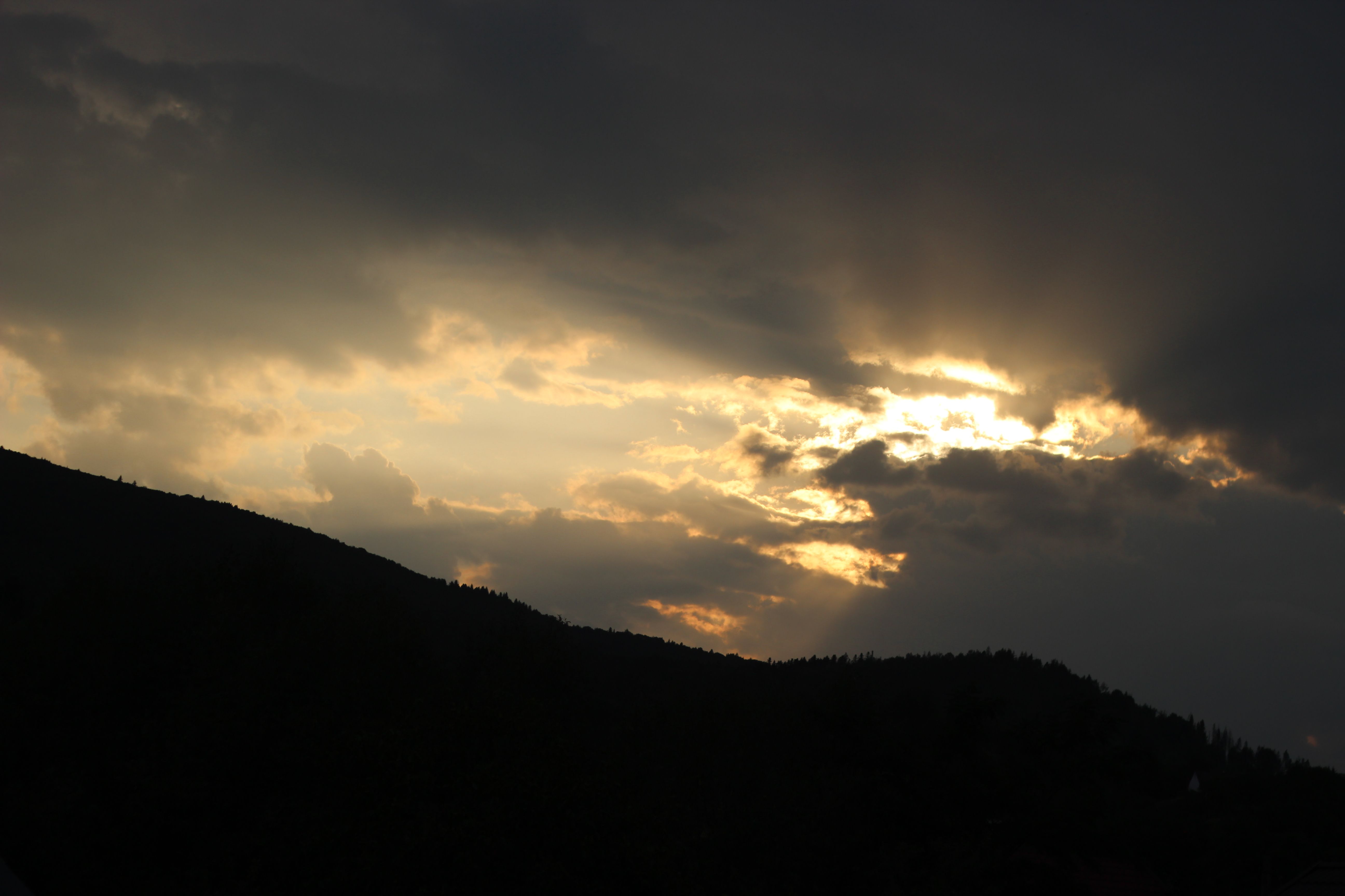 Clear Sky over Clouds over Hills at Sunset · Free Stock Photo