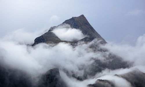 Free Capture of Lofoten peaks enveloped in clouds, showcasing nordic nature's magic. Stock Photo