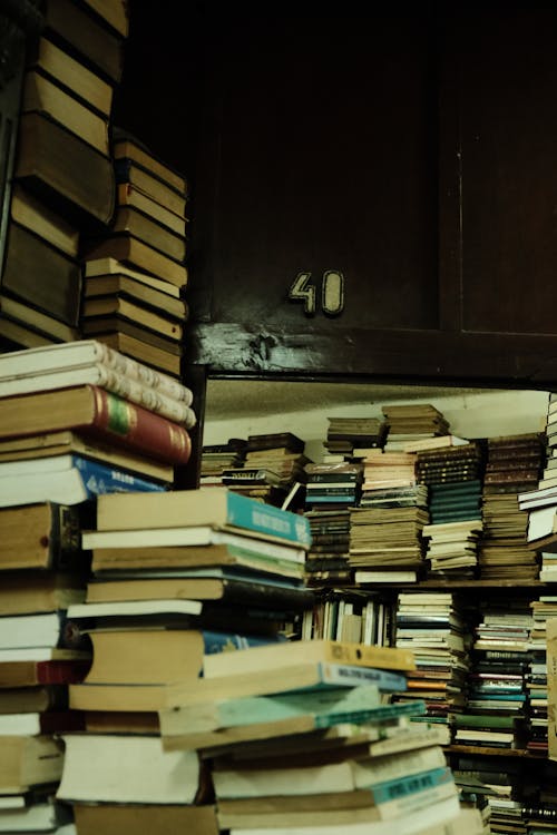 Stacks of Old Books in a Library