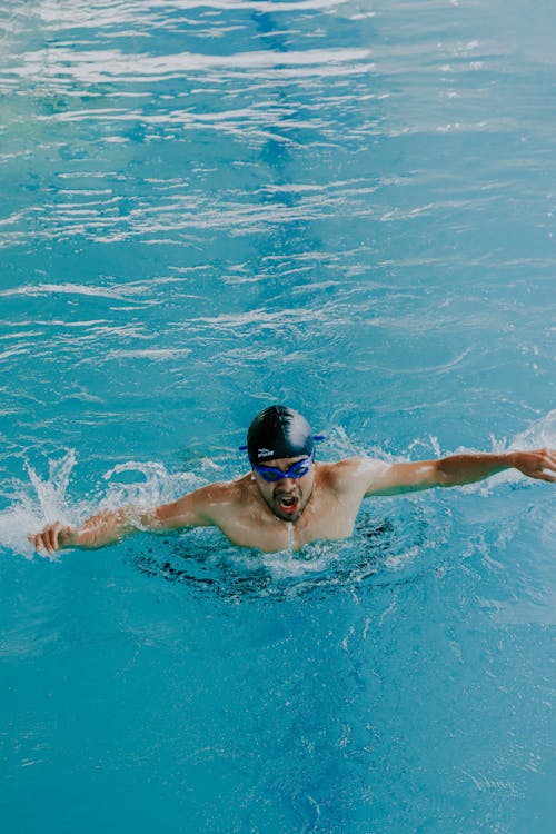 Man Swimming at Pool