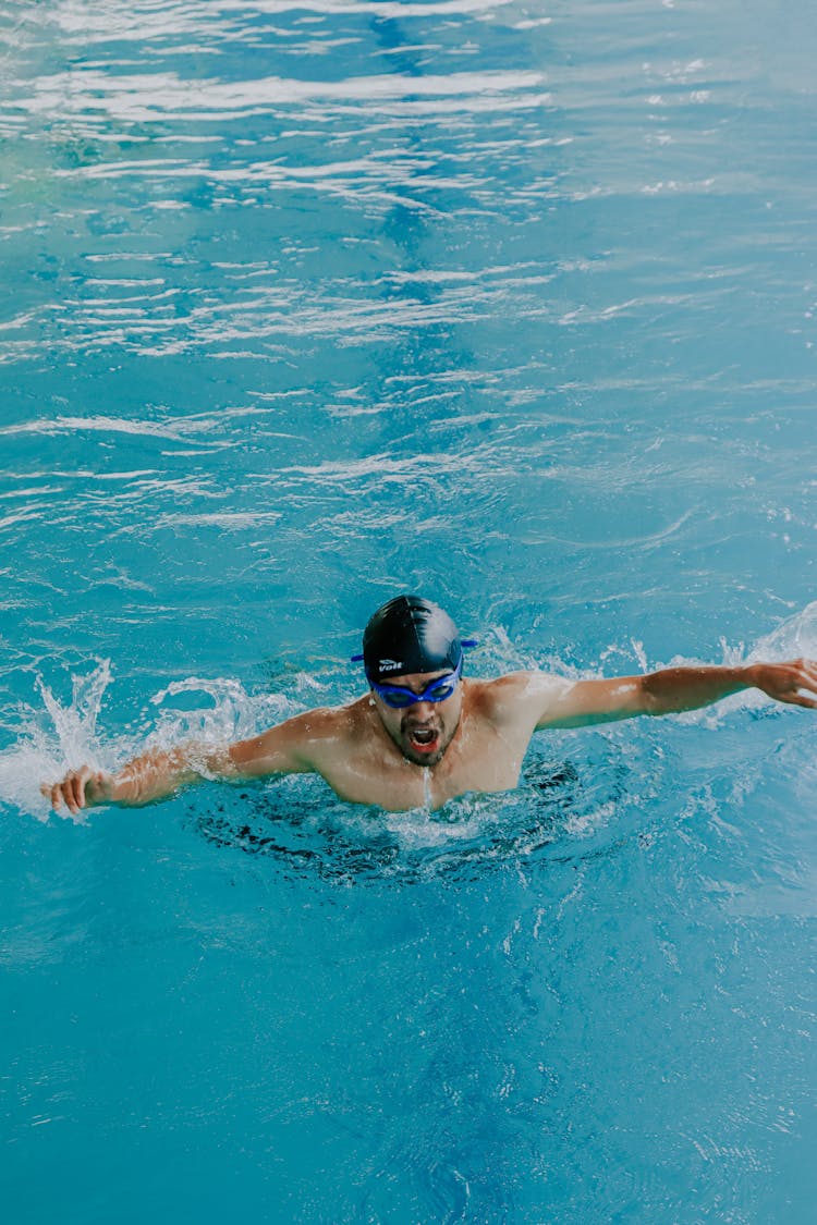 Man Swimming At Pool