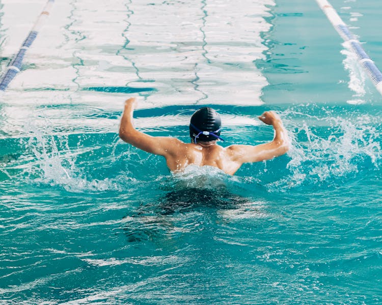 Man Swimming At Pool