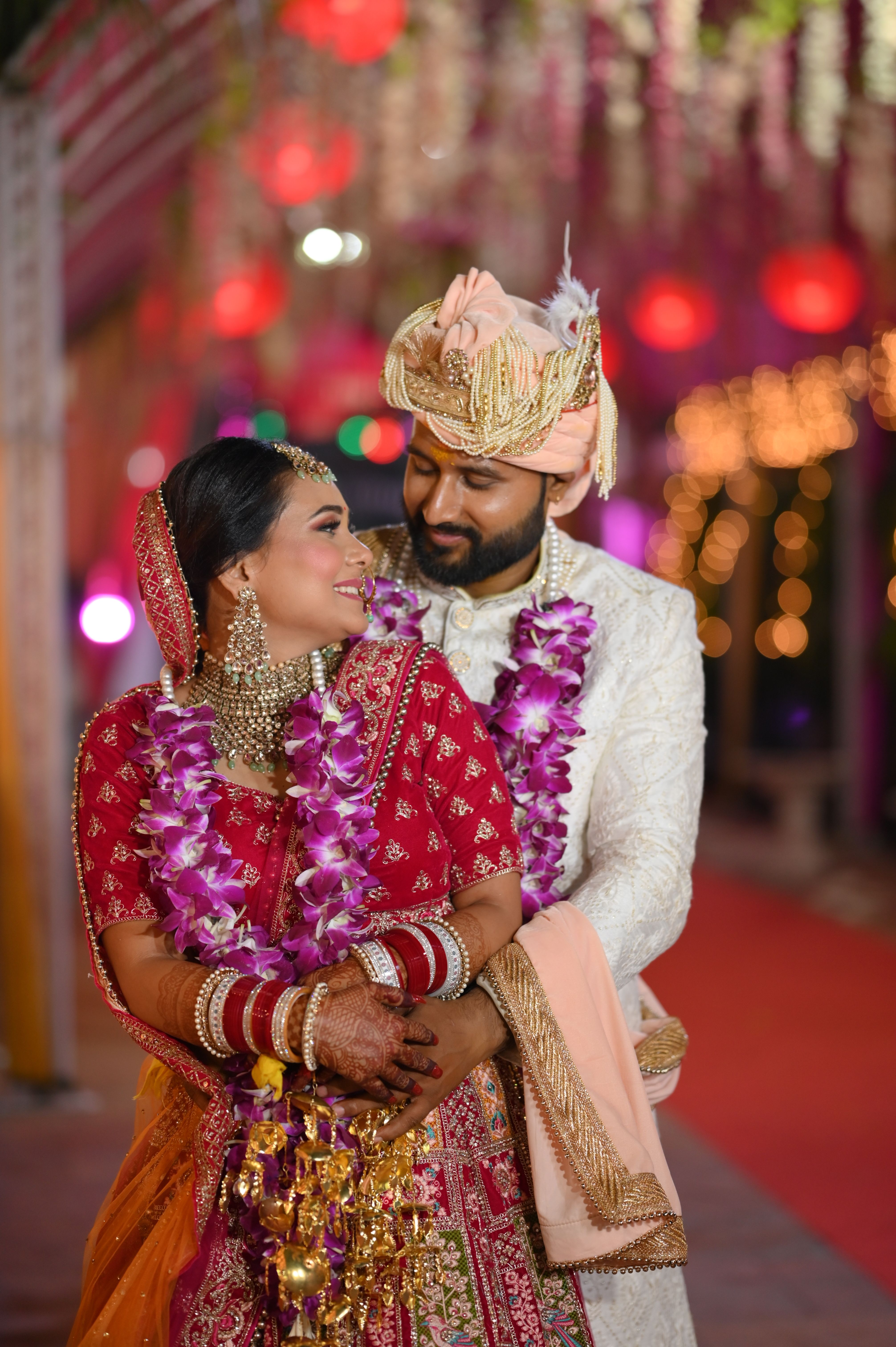 Couple in Traditional Wedding Clothes Hugging · Free Stock Photo