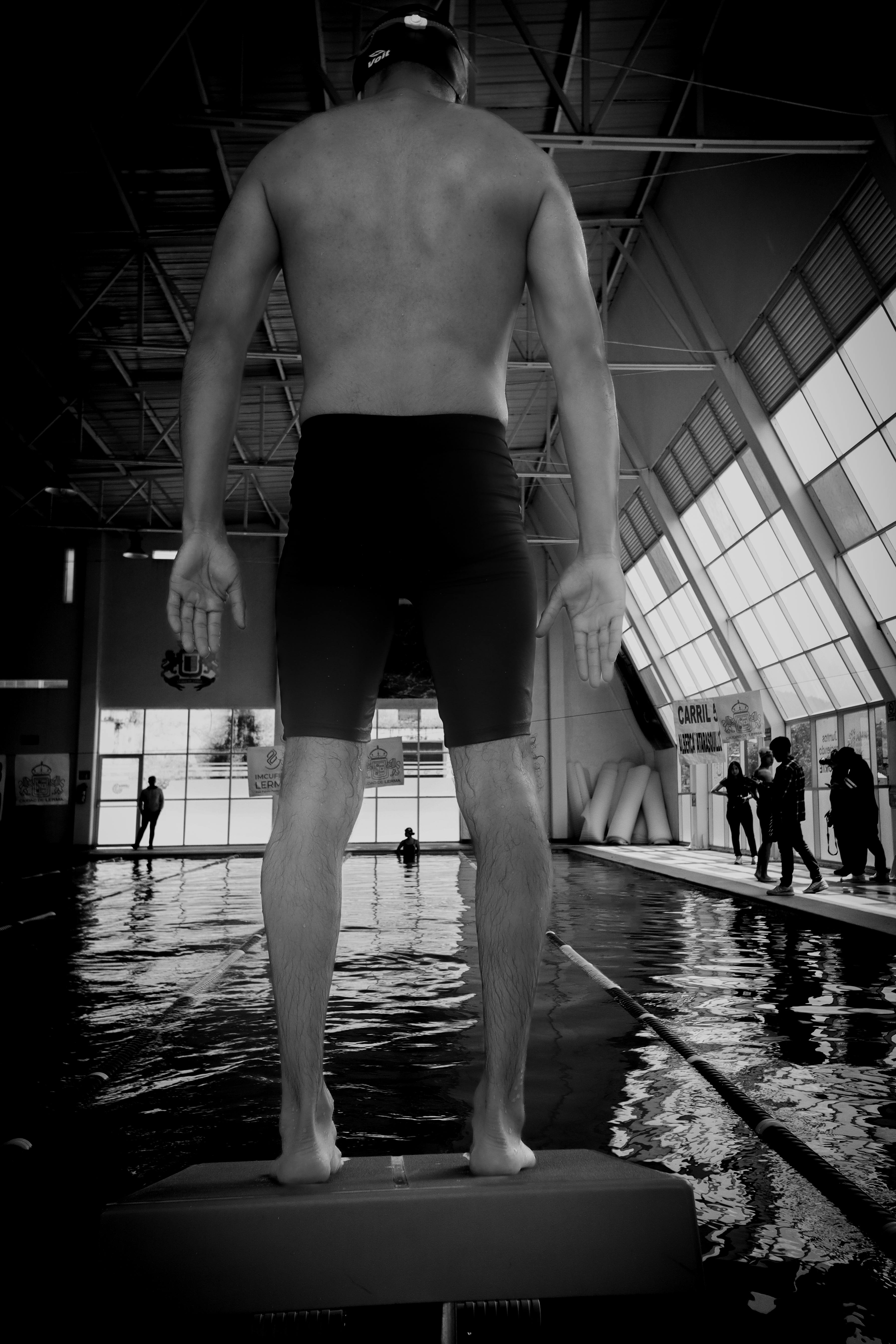 back view of man at swimming pool