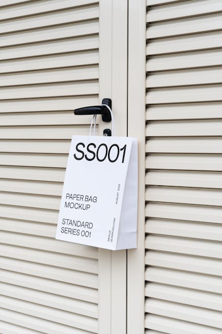 A close-up view of a paper bag mockup hanging on a door handle in Timișoara, Romania.